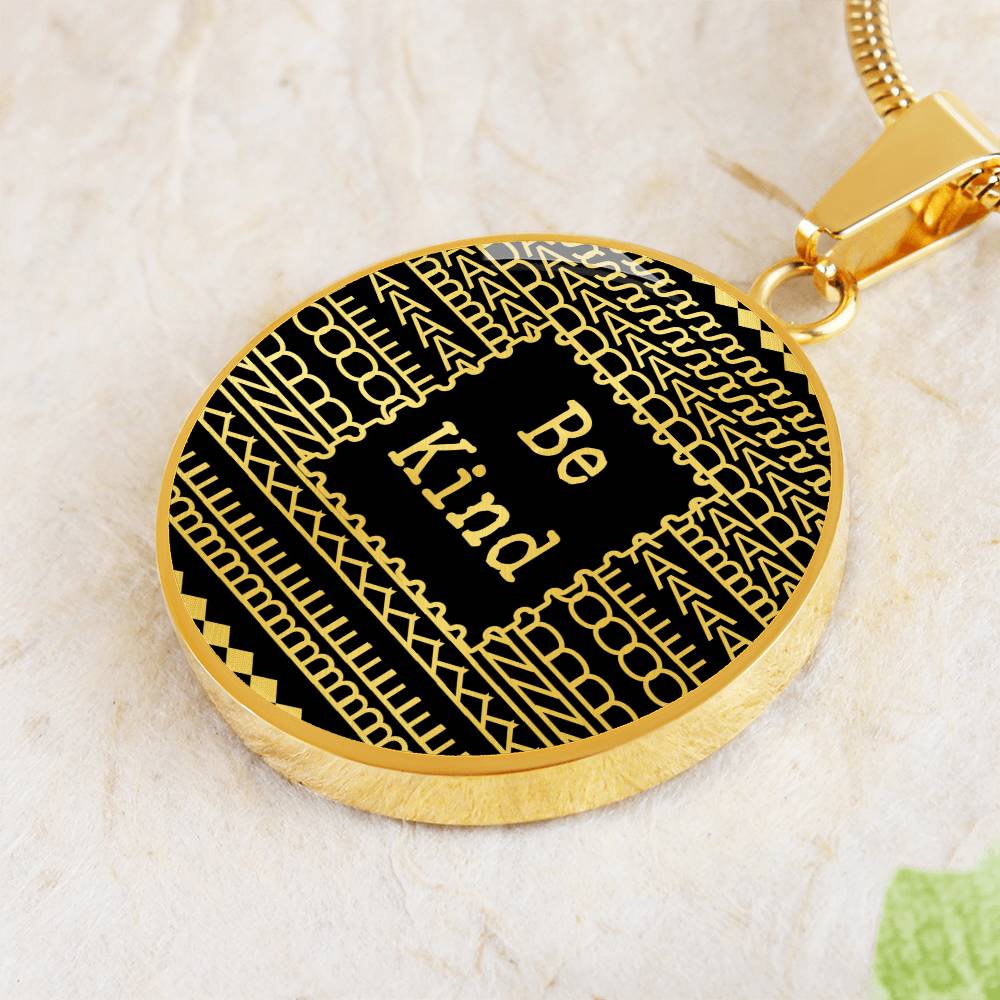 Close-up of 0.9 inch round pendant with be kind of a badass message